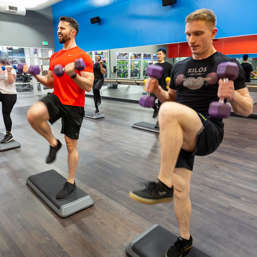 group lifting weights in bootcamp class in gym near me