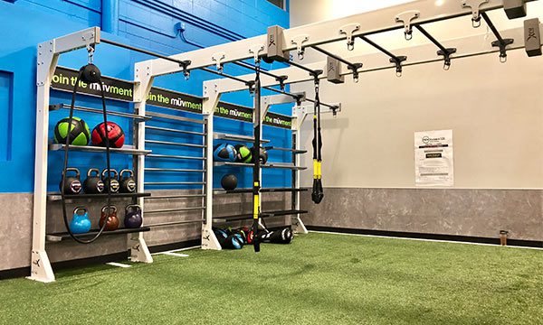 Rack of Weights and Turf in muv Fitness Center