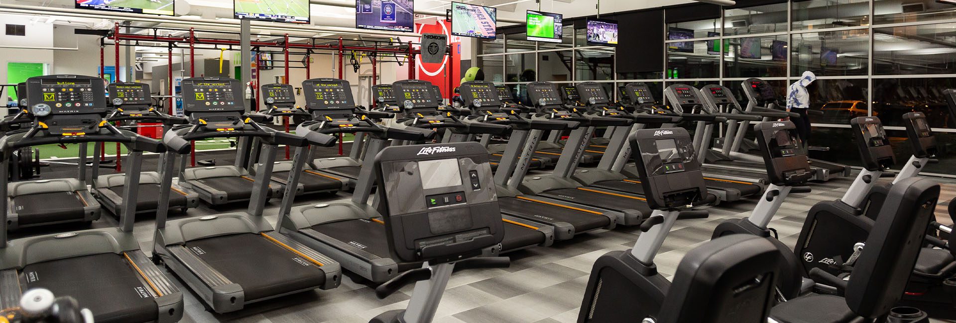 rows of cardio machines in gym near me