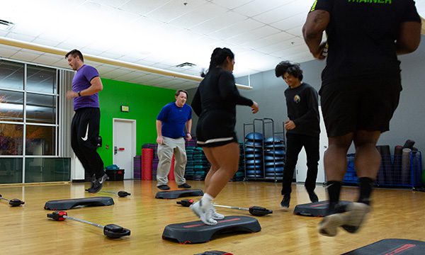 people working out in a fitness class in gym near me