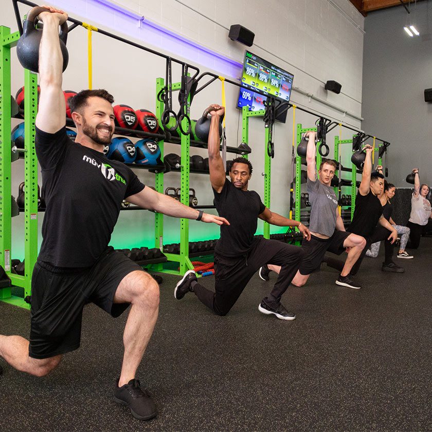 group using workout equipment in gym