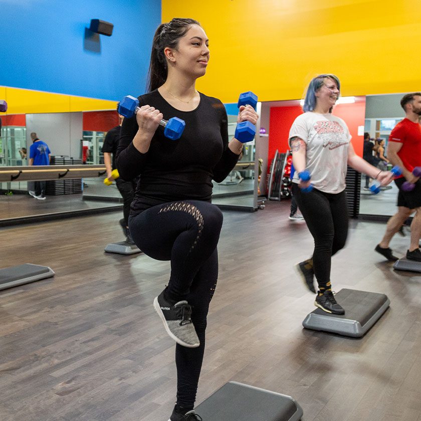 people exercising in a group fitness class