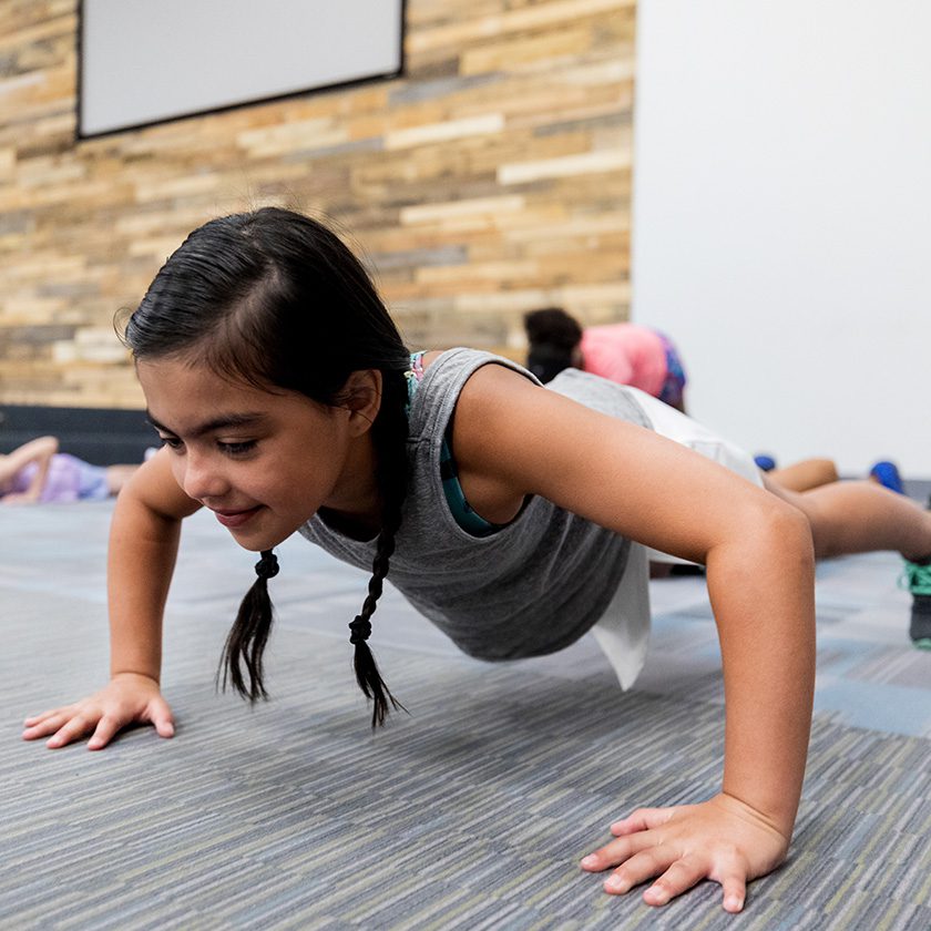 little girl working out in a fitness center
