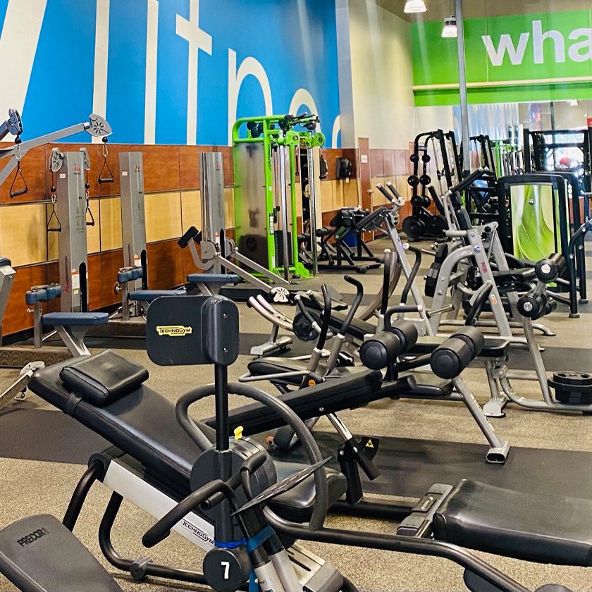 modern gym with tons of exercise equipment neatly organized