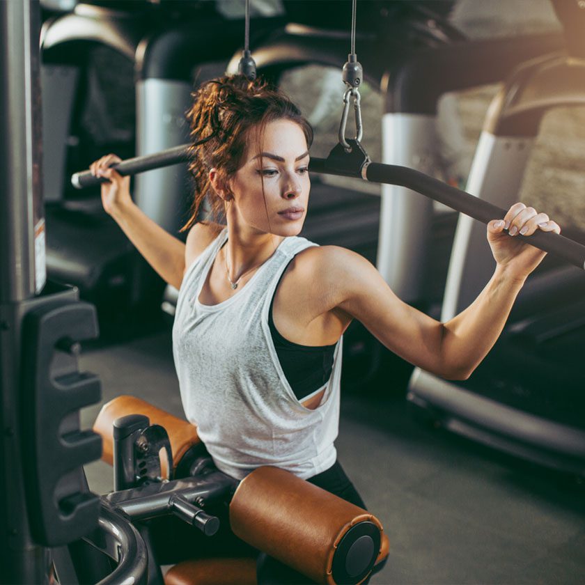 woman using modern gym equipment