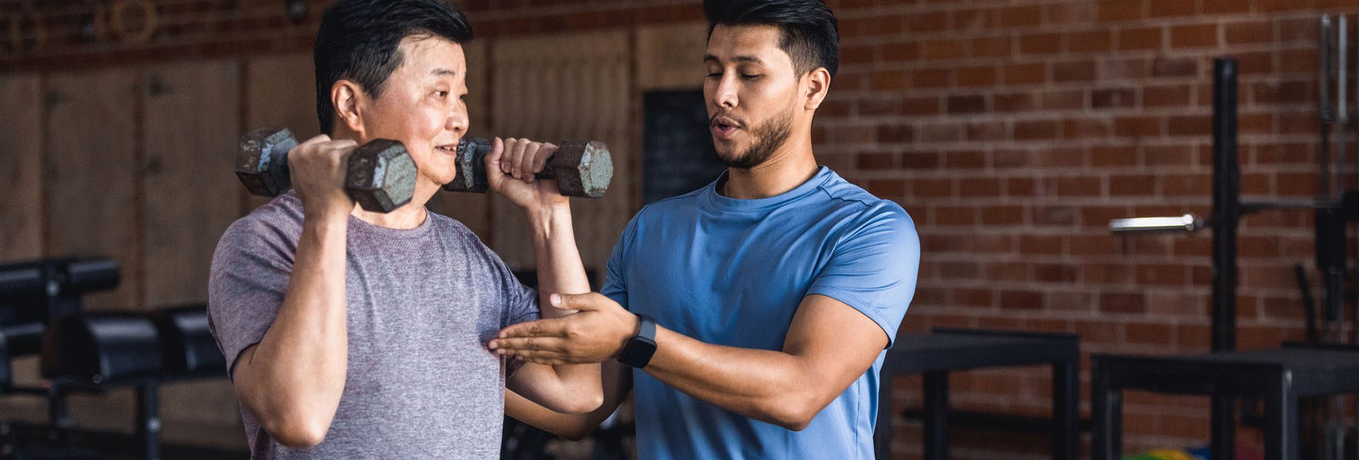 certified personal trainer working with a gym member