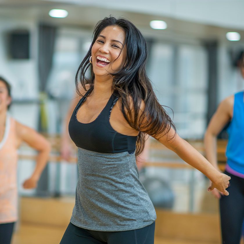 woman dancing in an exercise class in gym near me