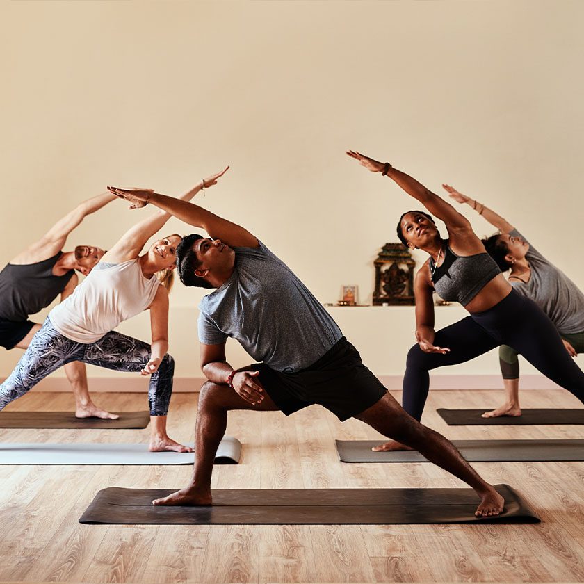 people stretching in a yoga class