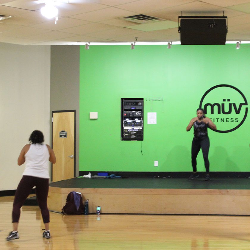 person learning kickboxing in a modern gym