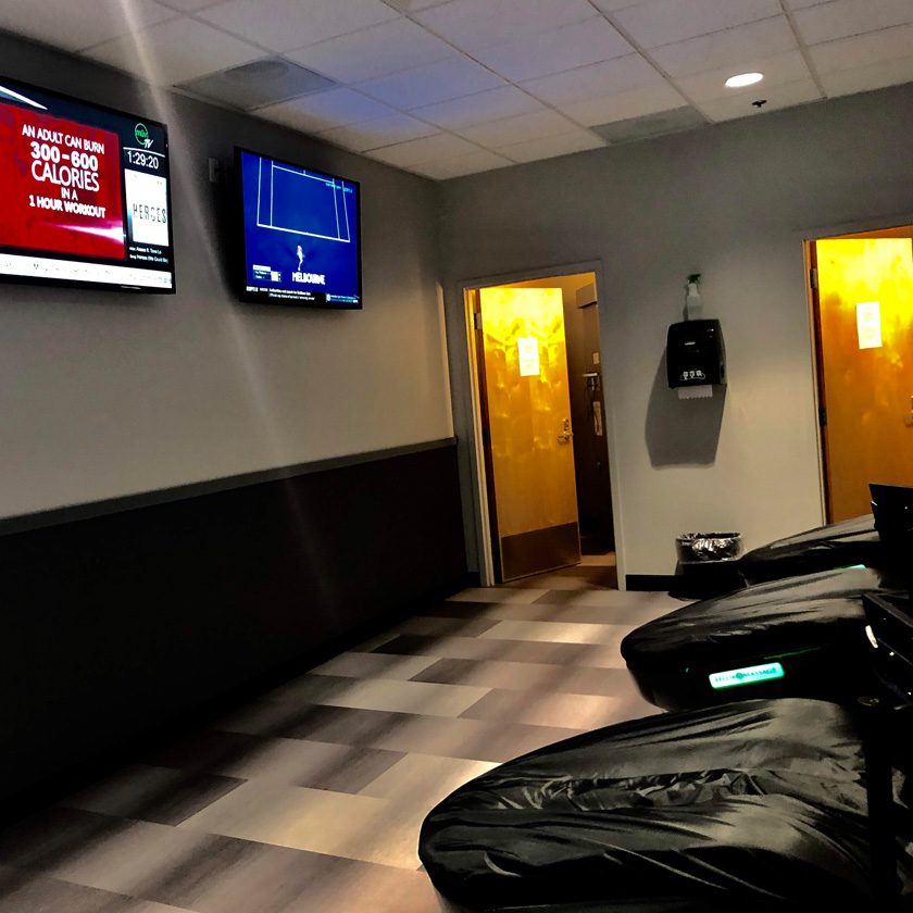 tvs in front of hydromassage chairs at a gym in north spokane