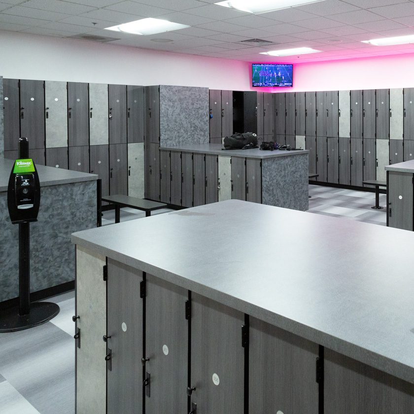 safe lockers with a tv and hand sanitizer station at a gym in north spokane