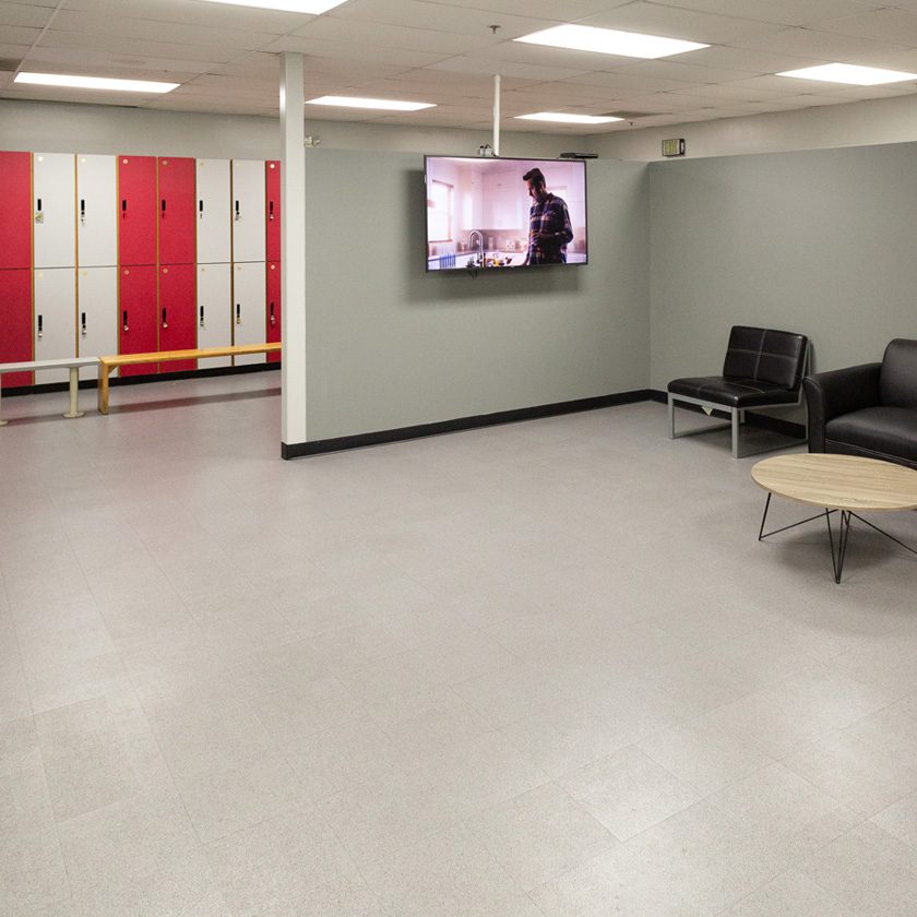 safe lockers with a tv and sitting area at a gym in north spokane