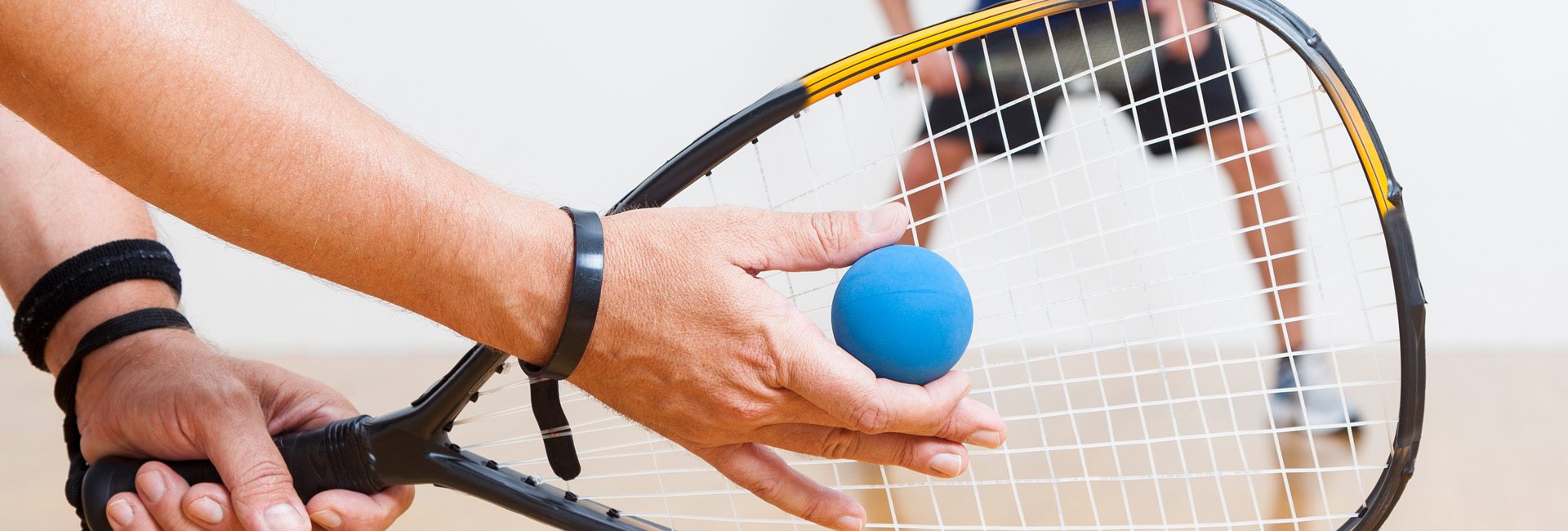 people playing racquetball at a gyms indoor court in north spokane