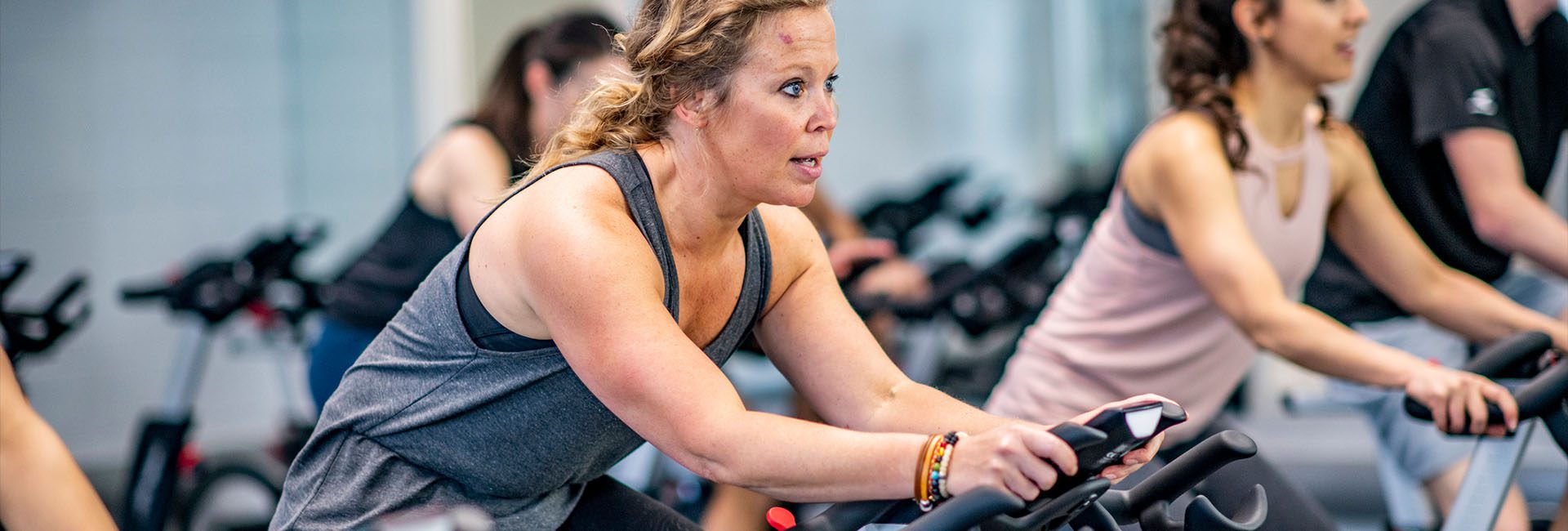 woman on a spin bike in gym fitness bike