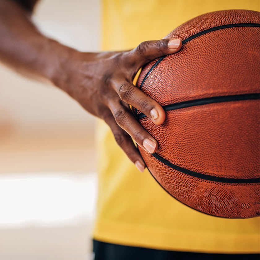 man holding basketball in gym near me south spokane