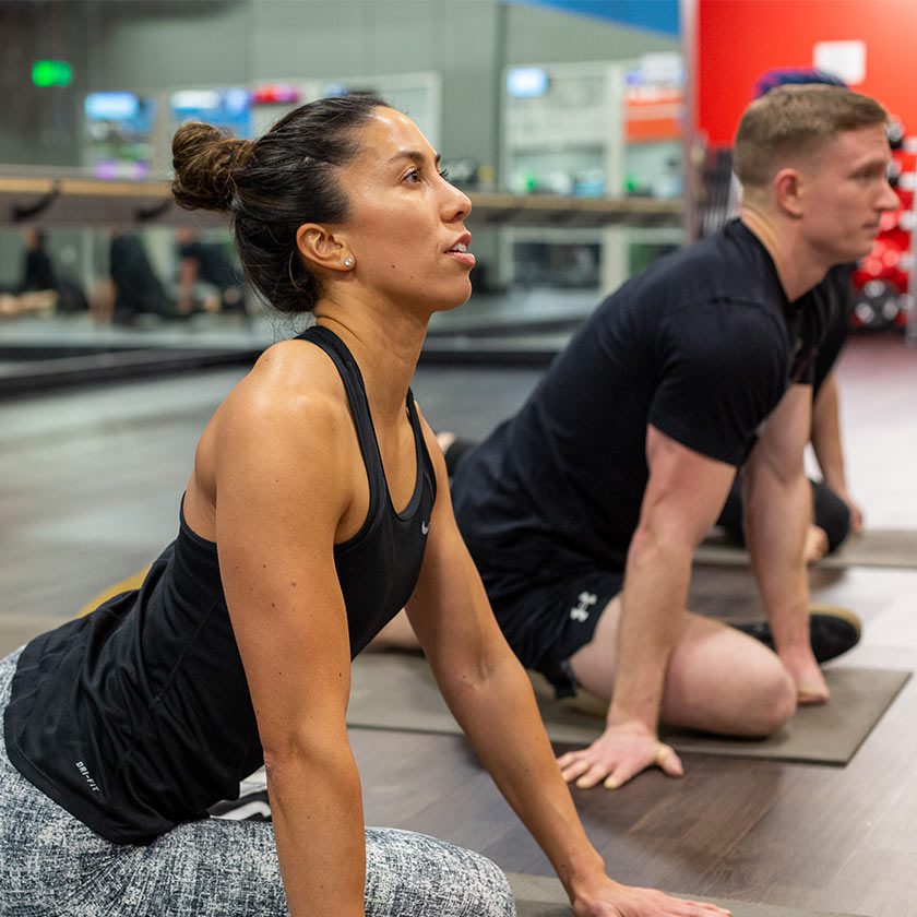 woman doing yoga in gym