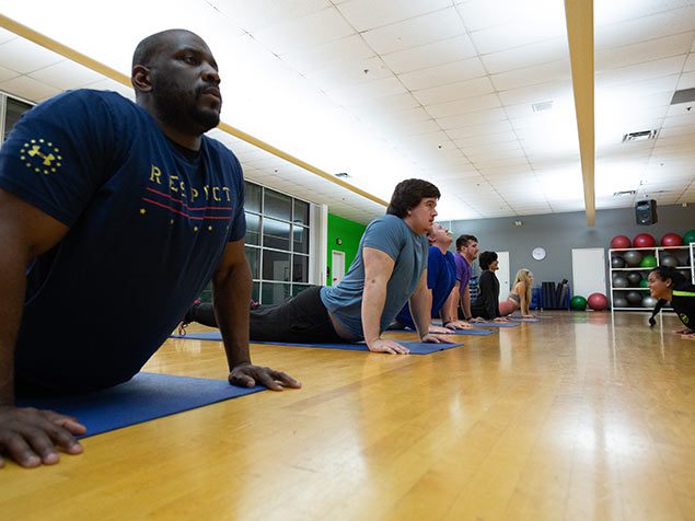 group doing yoga in gym near me south spokane