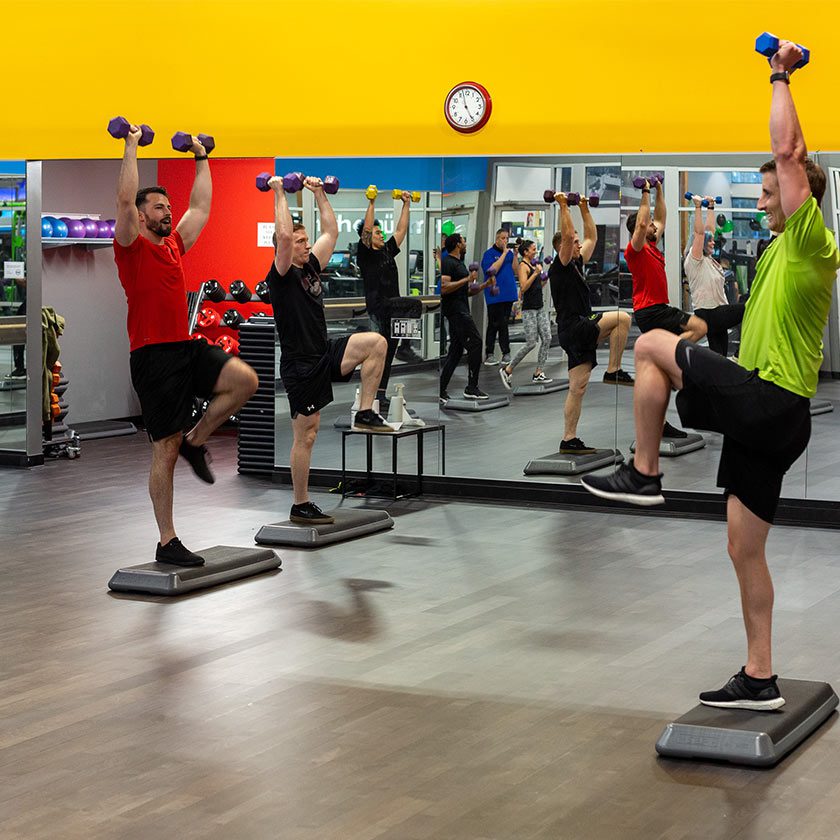 group working out in bootcamp in gym