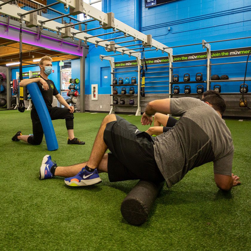 personal trainer and client working out in gym near me south spokane