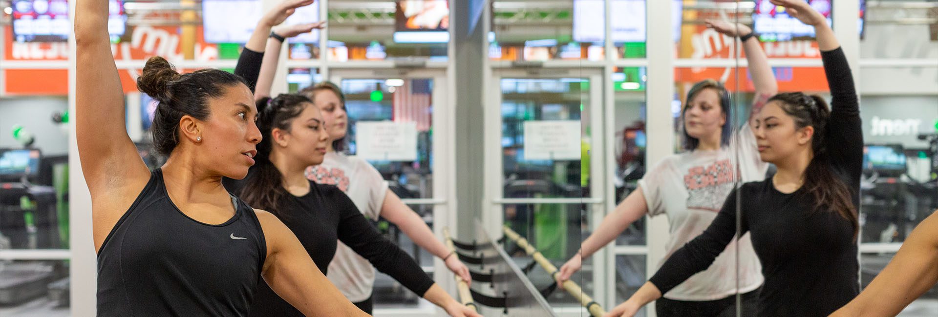 women in a barre class