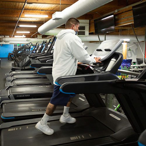 man walking on a treadmill