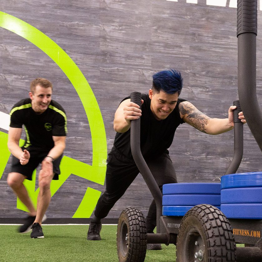 man pushing weights