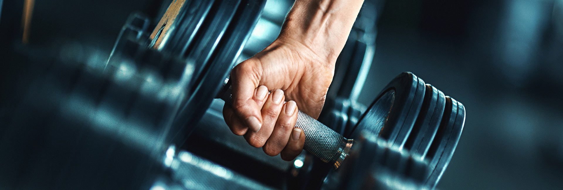 hand grabbing weights In Gym Near Me East Spokane