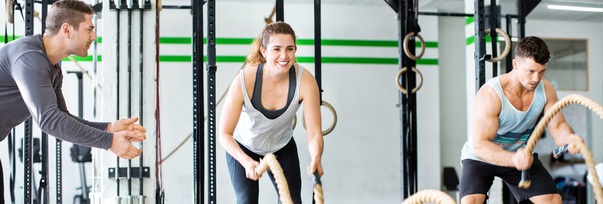 women working out with battle ropes