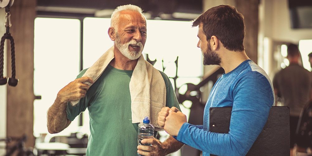 Men talking in gym